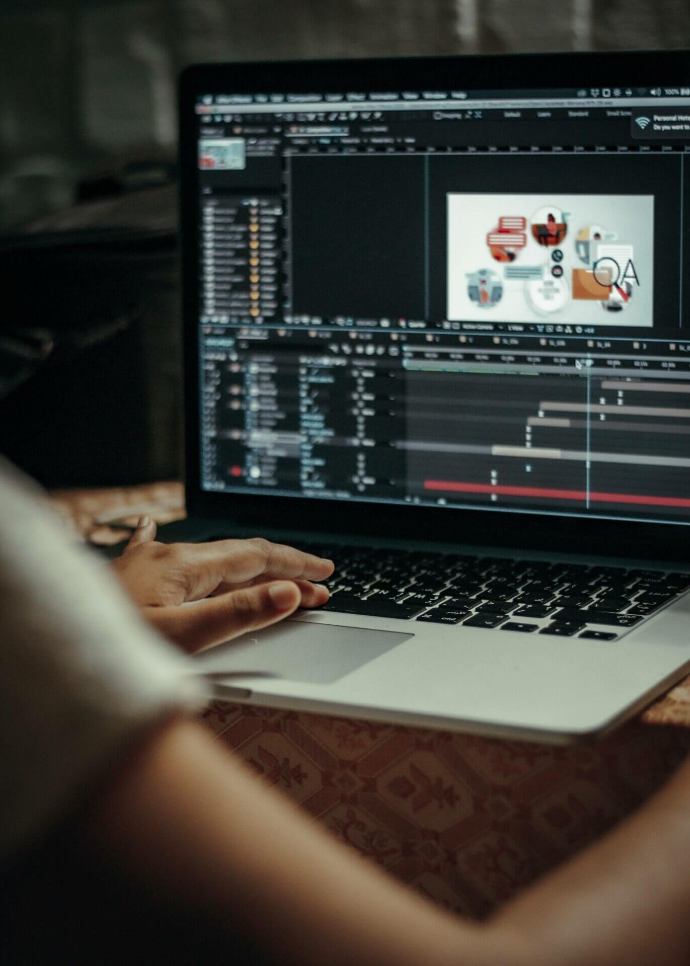 a person making 2d animation using MacBook pro